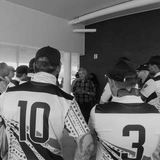 NO MORE Campaign Founder Charlie King speaks to the NT men's team about family violence and the symbolic linking of arms.