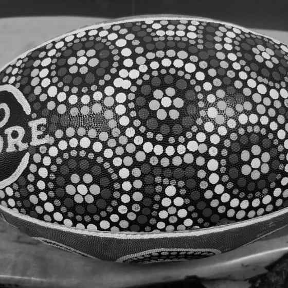 NO MORE NRL ball hand painted by Larrakia woman Rochelle Fejo.
