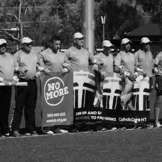 AFLCA Premier League Grand Final umpires, players and NO MORE campaign workers, Roy Arbon and Stan Coombe link up to say NO MORE to family violence.