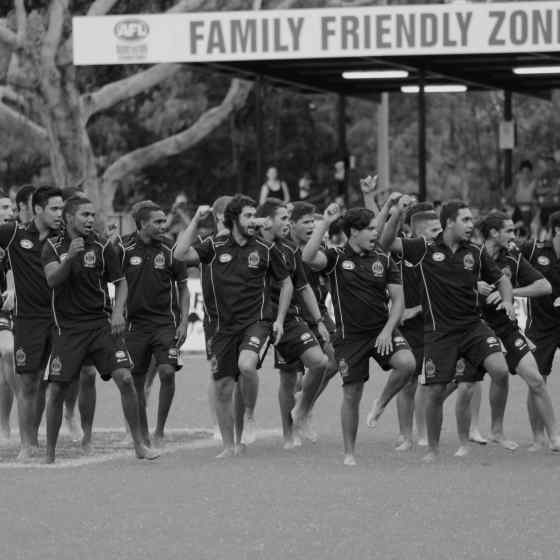 Rio Tinto Footy Means Business Indigenous team showing the crowd their war dance before the NTFL Grand Final match. 