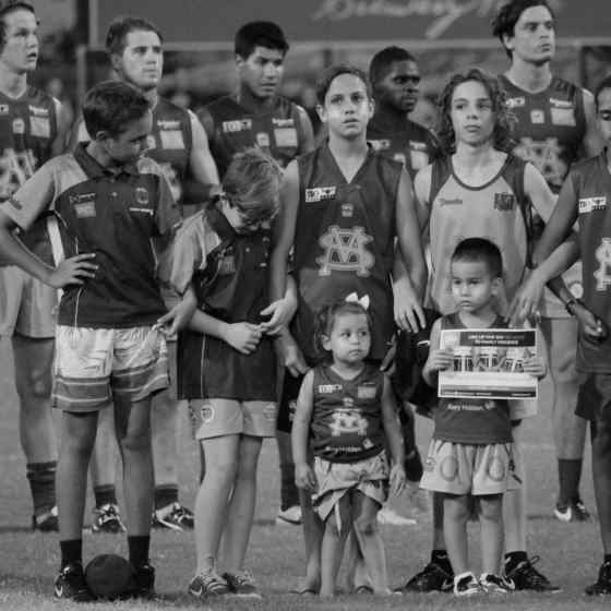 St Marys junior players link arms to say NO MORE to family violence.
