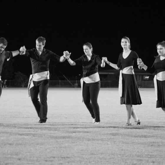 Greek dancers performed at half time of the last game. 