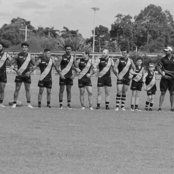 Nightcliff FC link up on the ground before the start of the game. Photo Credit: Lou Reeve