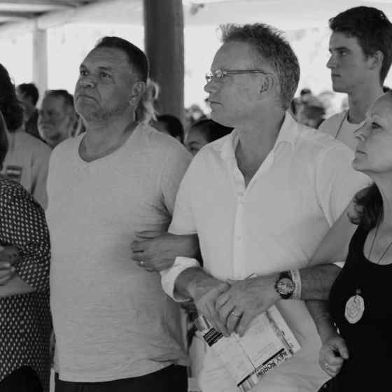 People in attendance at the NO MORE Campaign panel link arms to show their support.