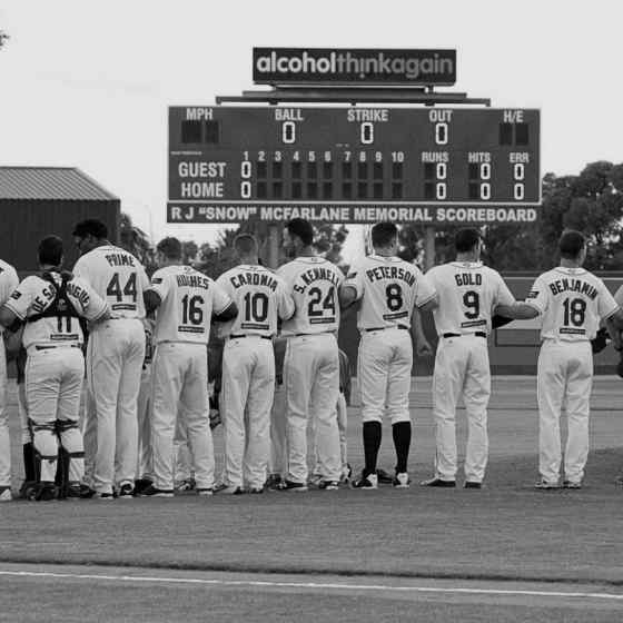 Australian Baseball League Perth Heat link up during the Australian national anthem.  Photo Credit: Wendy De'Souza