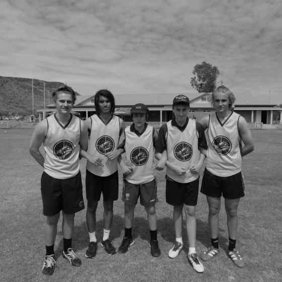 Yirara College players link up and say NO MORE to family violence.