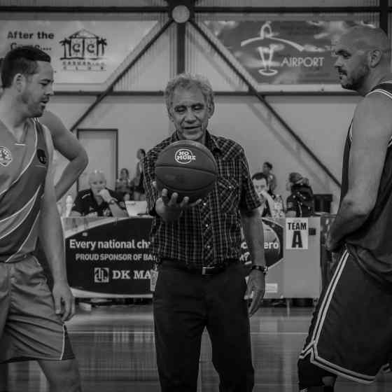 Charlie King throws the ball for the tip off of the first game between NT and Qld. 