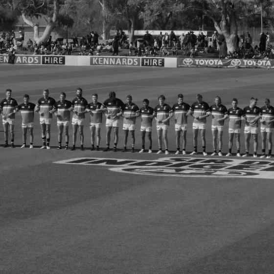Port Adelaide FC link arms saying NO MORE to family violence.