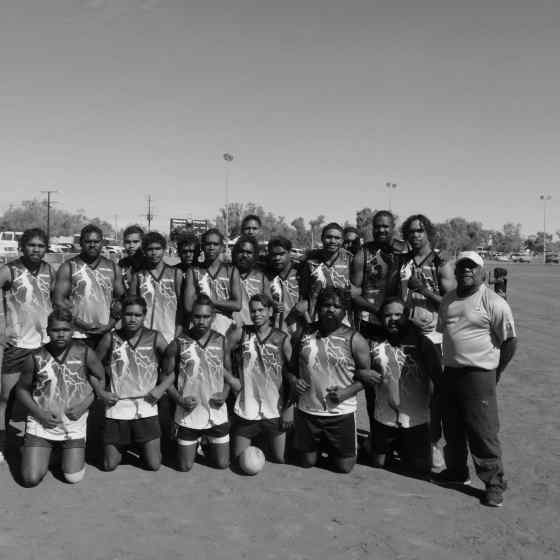 Plenty Highway links arms before the match. 