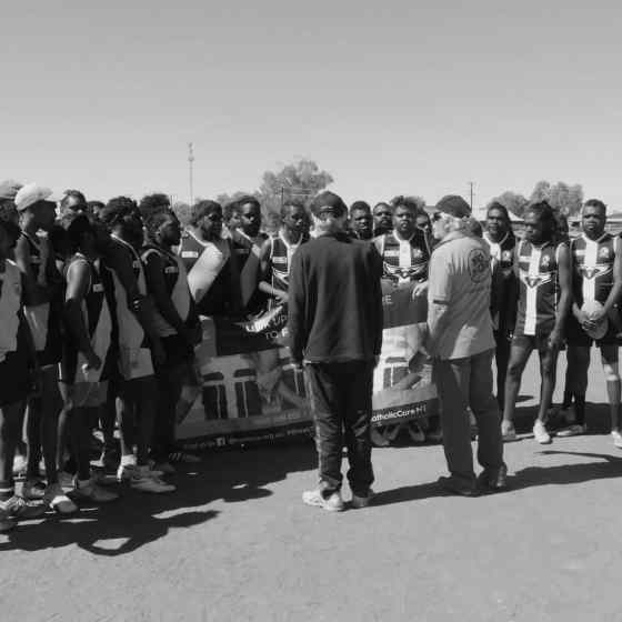 Roy and Stan speak to the teams about the importance of being good role models for their communities on and off the field.