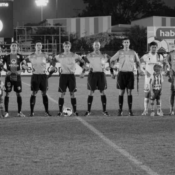 Adelaide United FC and Melbourne City FC link arms to show their support in saying NO MORE to family violence. 